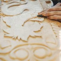 Carpenter works with a tree