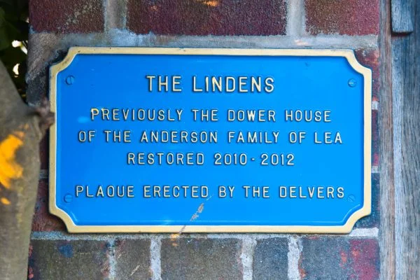 A picture of a plaque that reads: Previously the Dower House of the Anderson Family of Lea. Restored 2010 - 2012. Plaque erected by the Delvers.