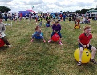 Children racing on space hoppers at Funtopia