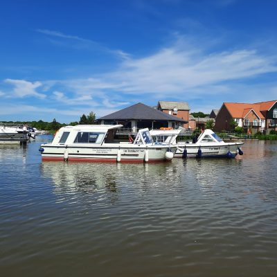 Two boats in the Burton Waters Marina.