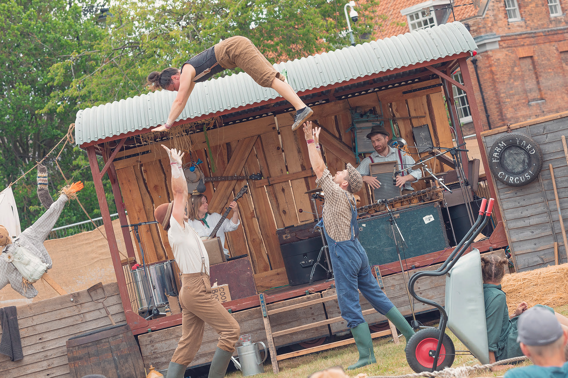 &#039;Farmyard Circus&#039; at the Revive Festival performing group acrobatics, juggling, theatre, and live music.