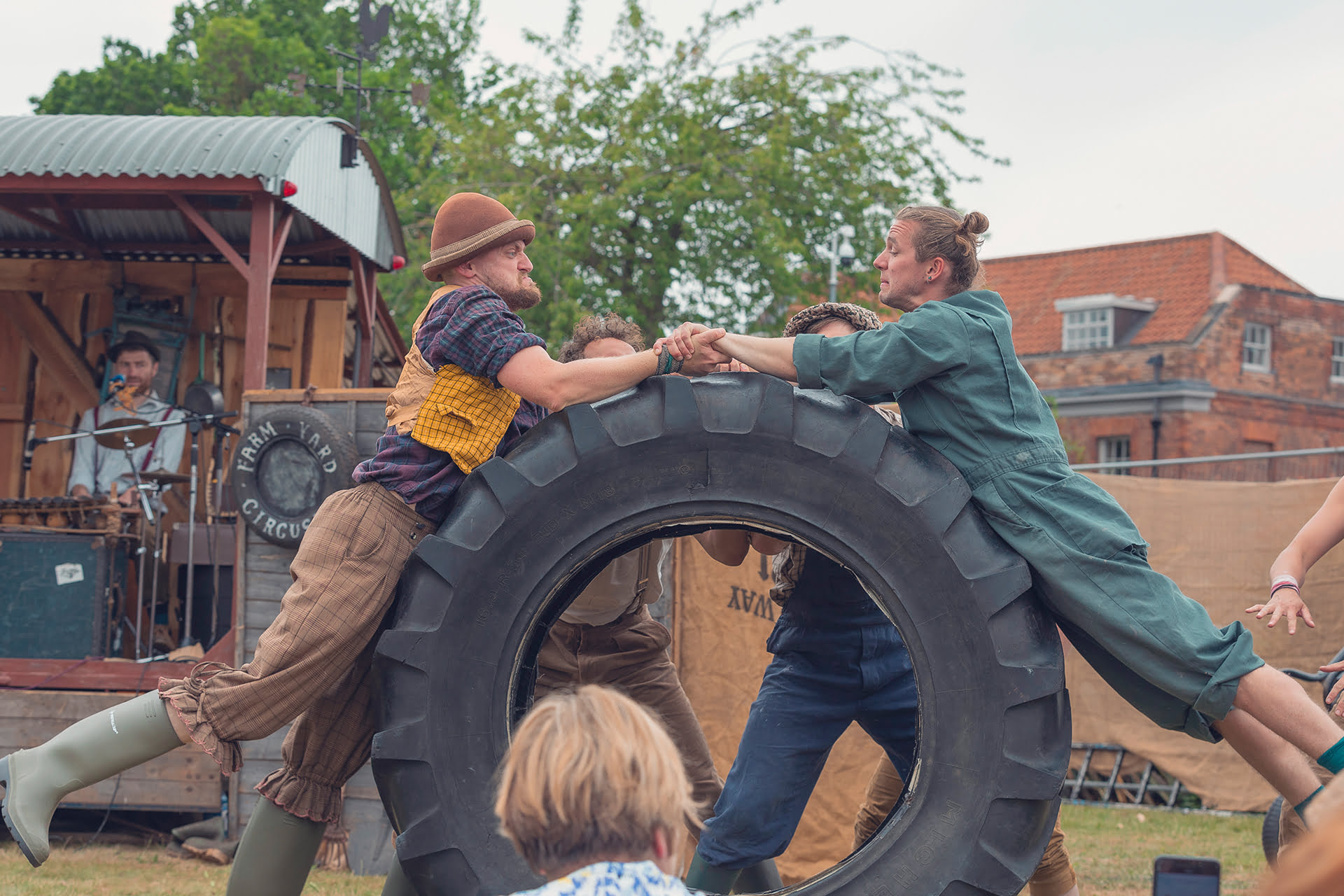 &#039;Farmyard Circus&#039; at the Revive Festival performing group acrobatics, juggling, theatre, and live music.