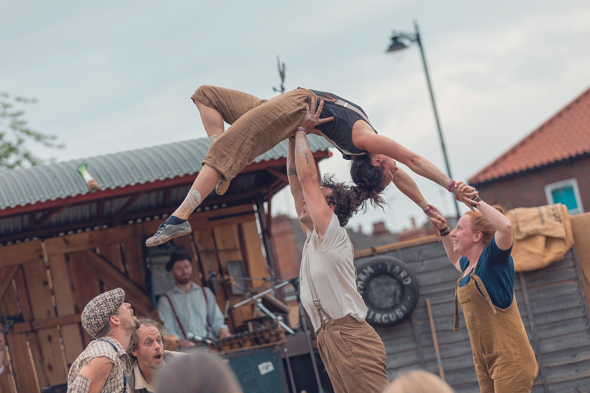 &#039;Farmyard Circus&#039; at the Revive Festival performing group acrobatics, juggling, theatre, and live music.