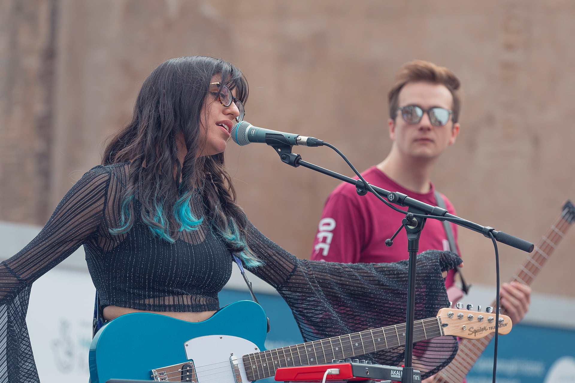 Georgie Hanson singing and playing guitar at the Revive Festival