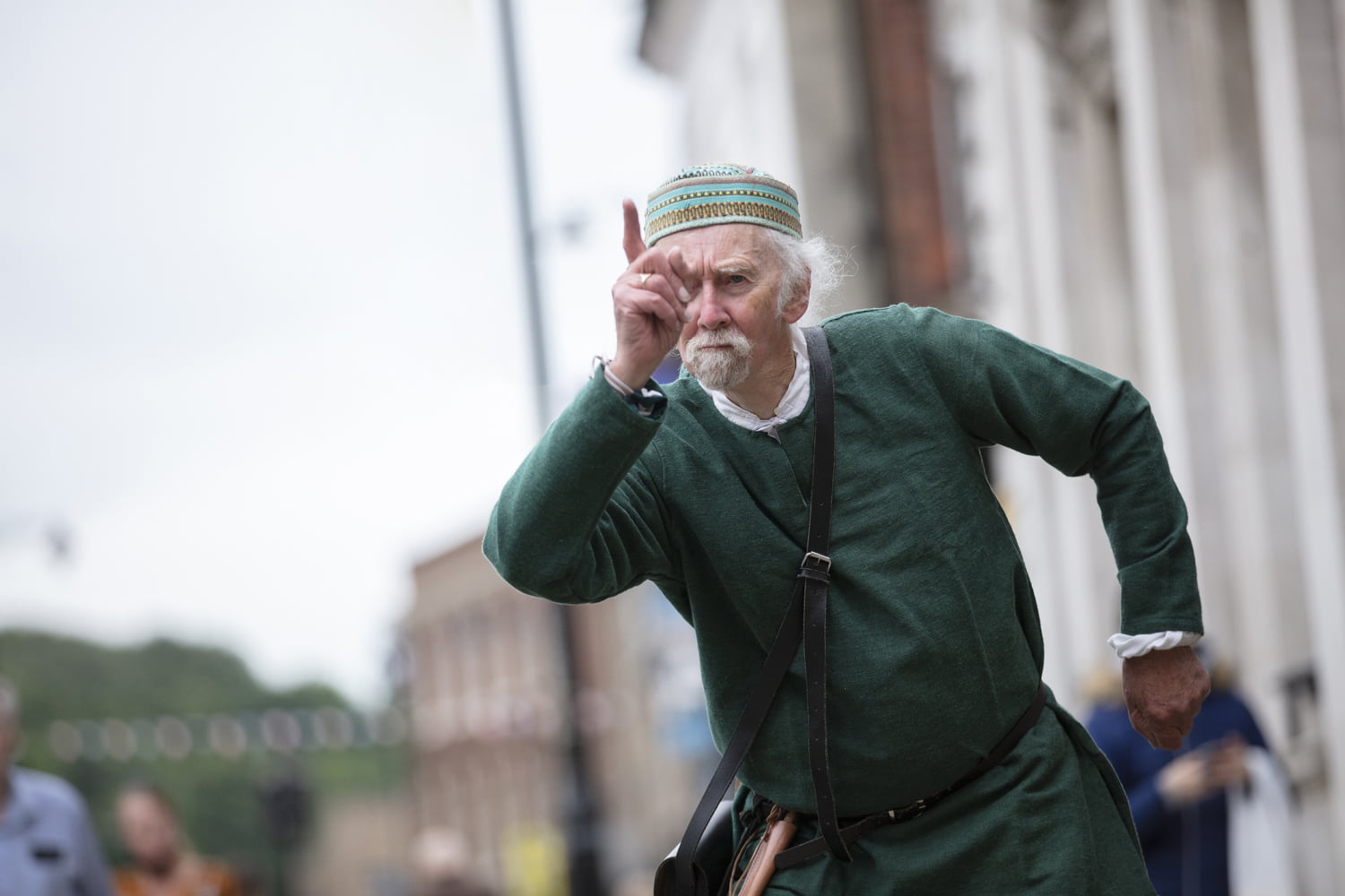 Man in period costume wagging his finger at the Merry Old Market