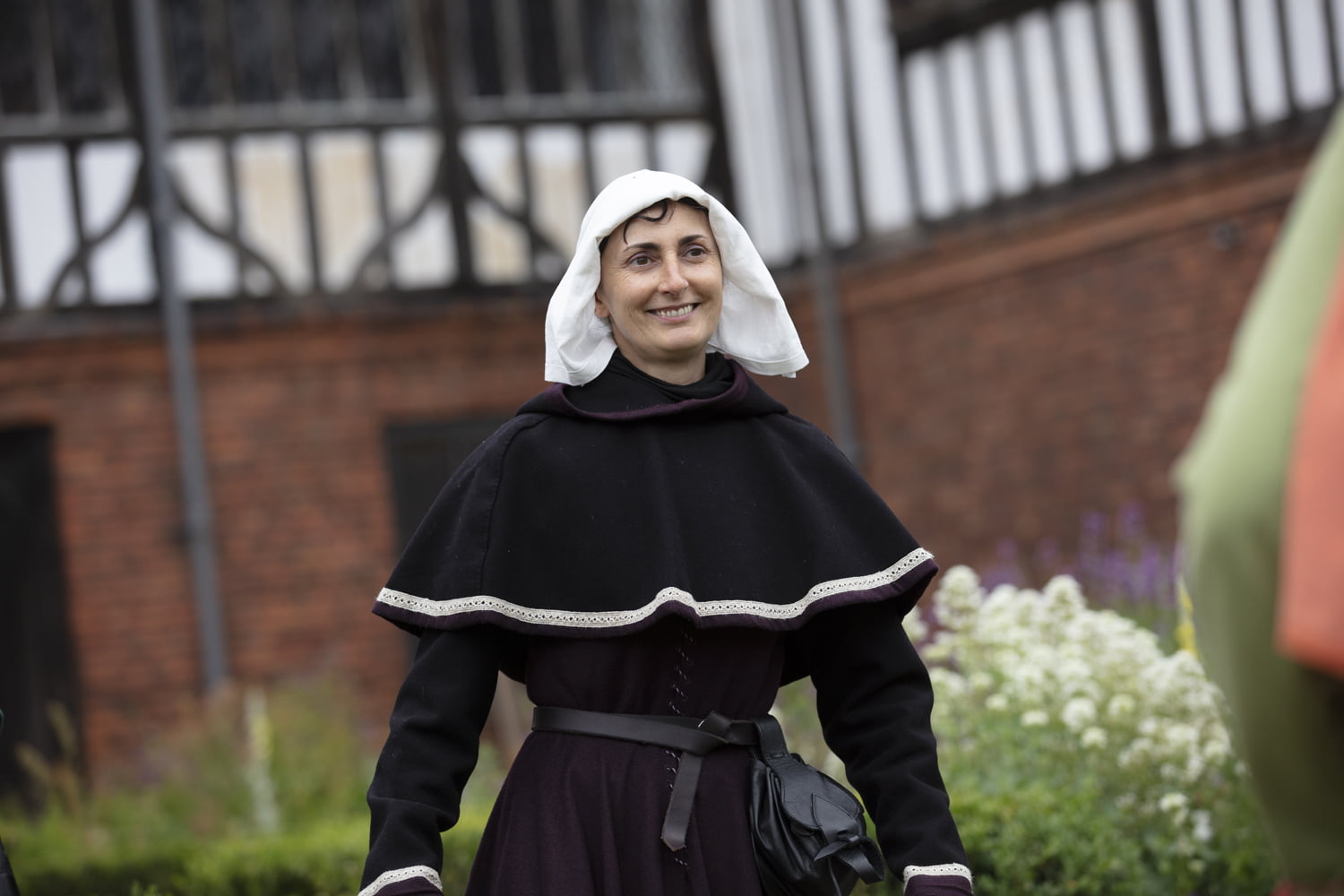 Woman in period costume outside Gainsborough Old Hall