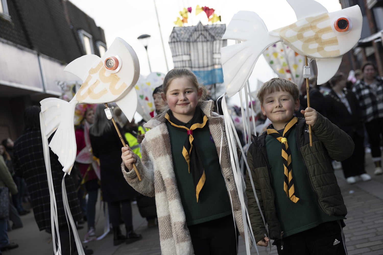Scouts holding lanterns at this year&#039;s illuminate parade.