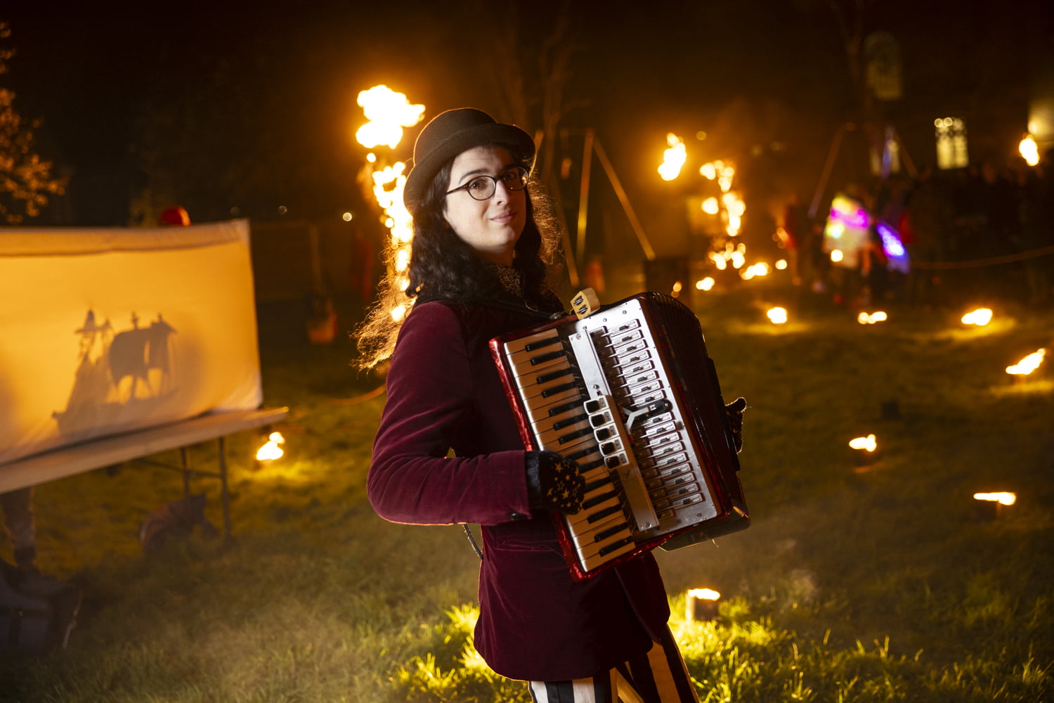 Accordion player in the fire garden at Illuminate 2024