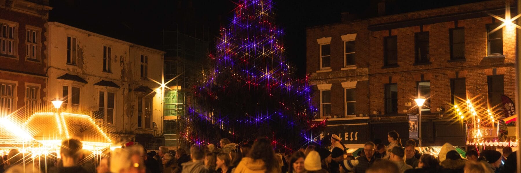 Crowds gathering around the Christmas Tree in the market place to enjoy the live music and performances.
