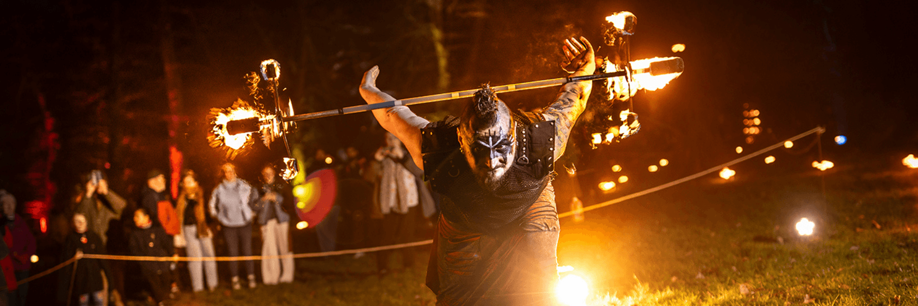 Image displaying fire performer at Illuminate 2025
