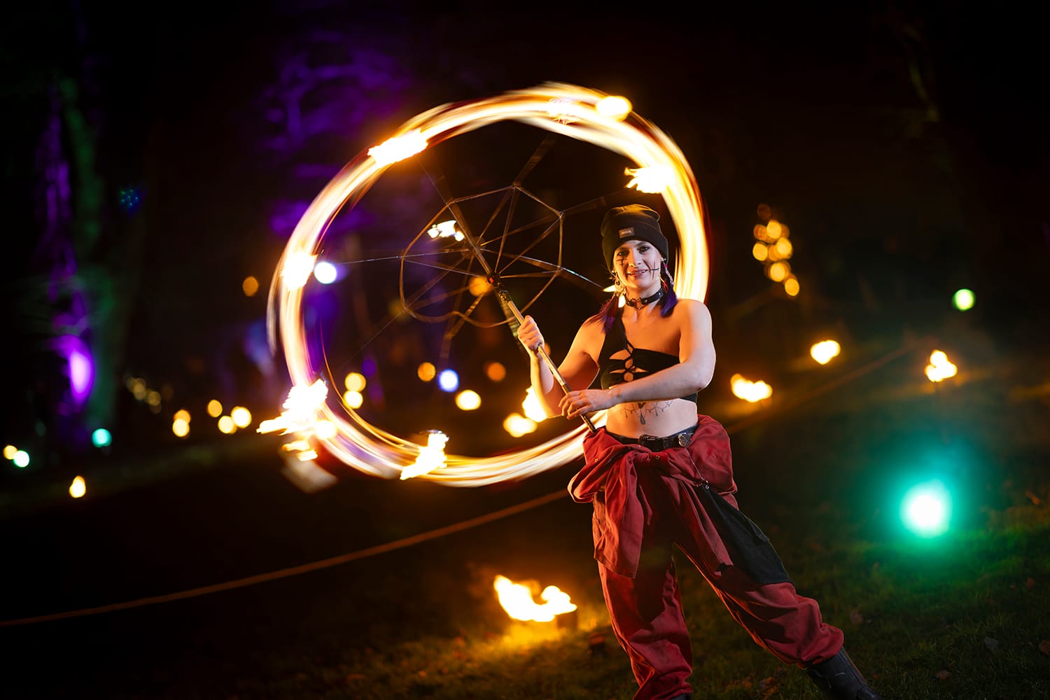 Fire performer in the Fire Garden at Illuminate 2025.